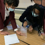 3- Grade 9 students conducting an experiment on physical and chemical changes/properties.